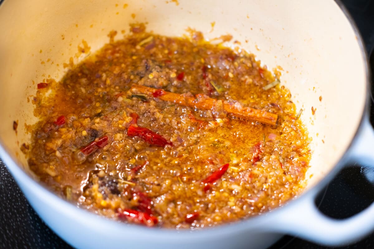 Spices and blended paste in a pot.