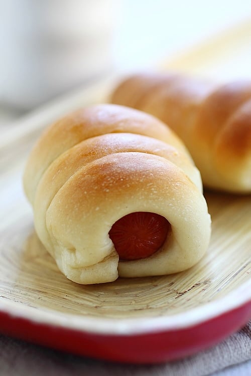 Original pigs in blanket recipe made of bread flour, yeast, butter, eggs, milk and sausages. 