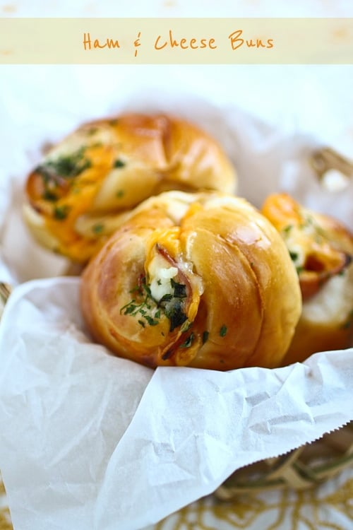 Ham and cheese buns served in a basket.