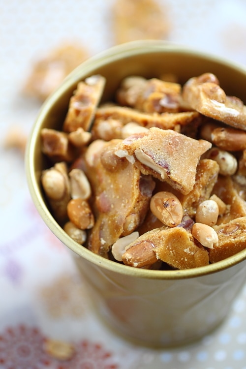 Easy and crunchy festive peanut brittle served in a bucket.