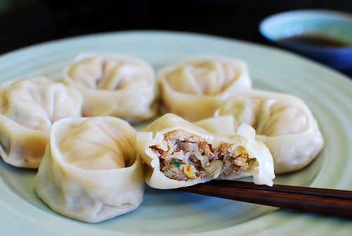 Easy korean mandu in half and picked by a pair of chopsticks.