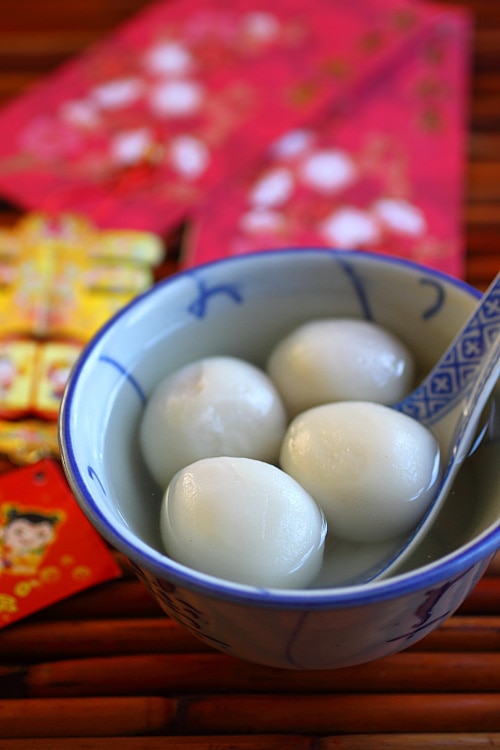 Chinese peanut tang yuan dessert served in a bowl with ginger syrup.