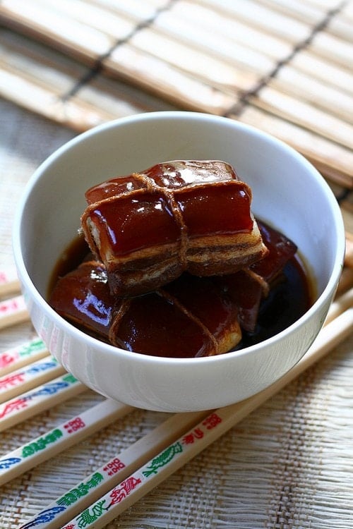 Easy and delicious Chinese slow cooked braised pork belly in thick brown sauce, ready to serve.