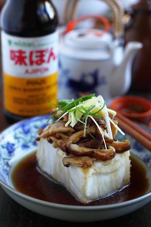 Easy and quick steamed fish in Chinese dark gravy topped with mushrooms and ginger, ready to serve.