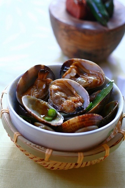 Malaysian golden fragrant clams stir fry in thick brown sauce.