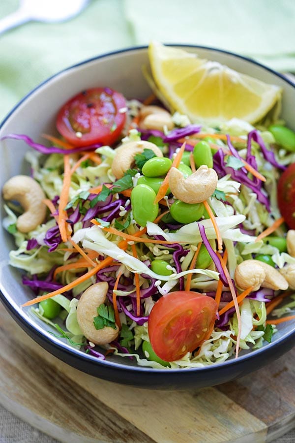 Asian cabbage slaw with Asian slaw dressing made of soy sauce and sesame sauce.