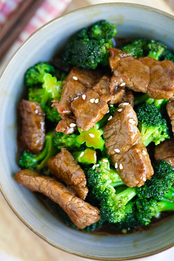 Beef and broccoli slathered in beef and broccoli sauce in a serving bowl.