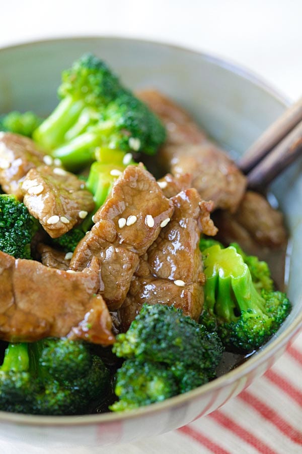 Homemade beef and broccoli recipe ready to serve in a stoneware bowl.