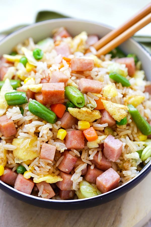 Spam fried rice recipe with a pair of chopsticks, ready to serve.
