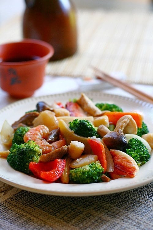 Chinese happy family vegetables and seafood stir fry in brown sauce.