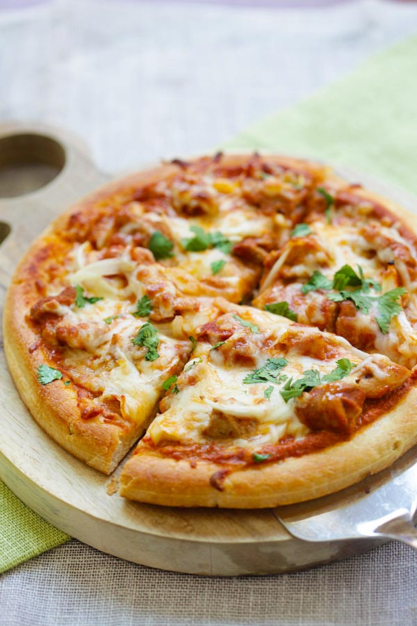 Easy and delicious homemade chicken tikka masala pizza with Indian tikka masala sauce.