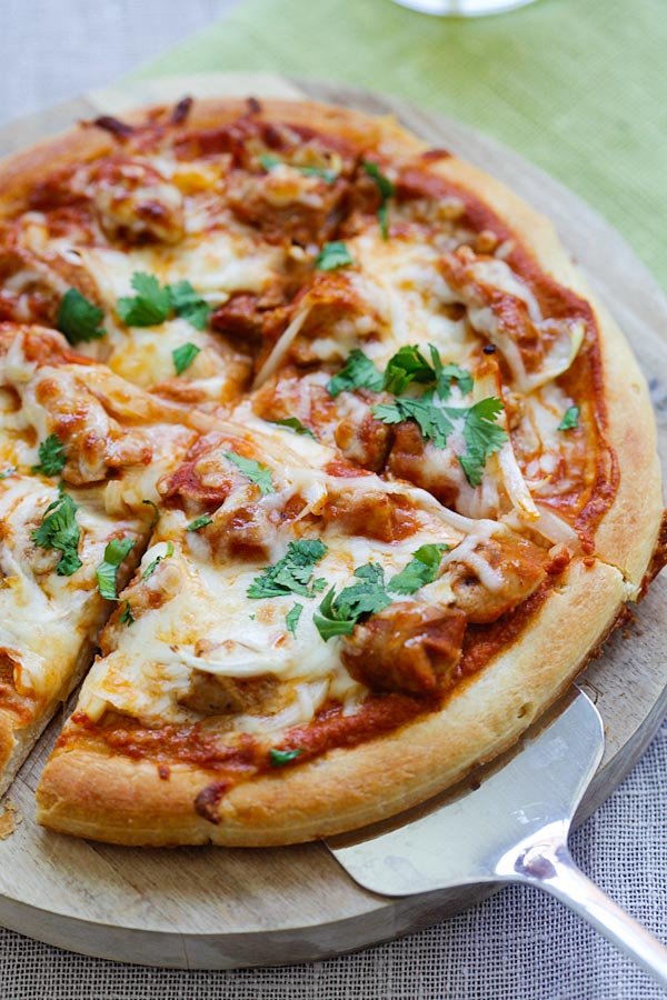 Chicken tikka masala cheesy pizza topped with delicious Indian chicken tikka masala sauce.