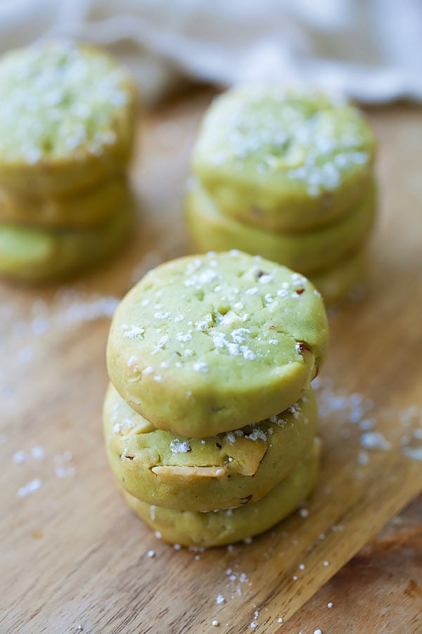Easy and delicious Japanese green tea butter cookies with almond nuts stacked together.