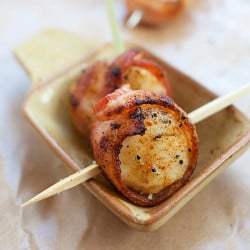 skewers of grilled scallops wrapped with bacon