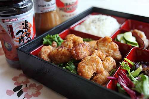 Easy homemade Japanese chicken karaage served in bento lunch box with side dishes, ready to serve.
