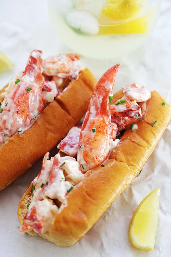 What is a lobster roll? Homemade New England lobster roll with New England style hot dog buns, lobsters and mayonnaise.