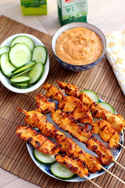 Easy authentic Thai grilled chicken skewers, served with a side of Thai sweet peanut sauce.