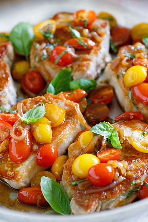 Healthy and delicious sauté sweet and sour pork chop cooked with tomatoes.