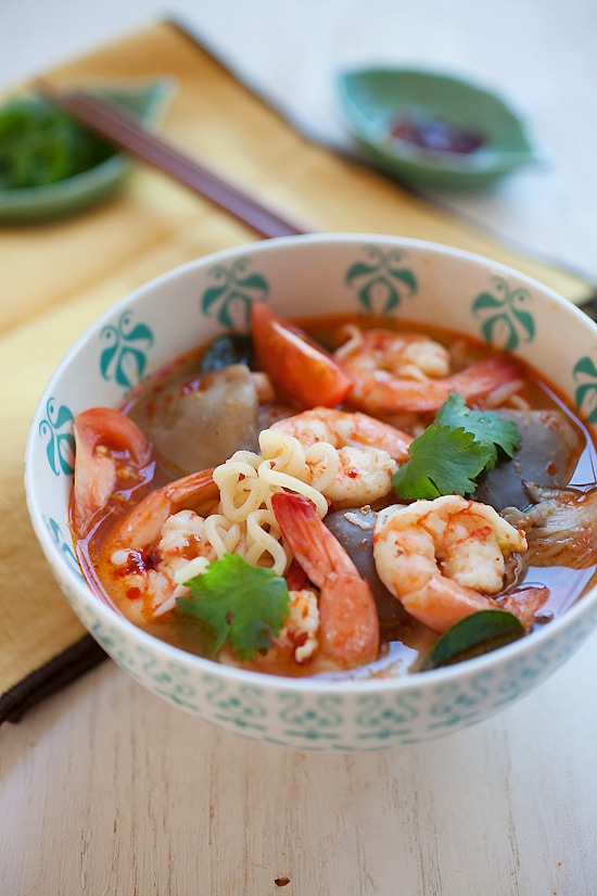 Easy and delicious Thai tom yum soup with prawns and noodles served in a bowl.