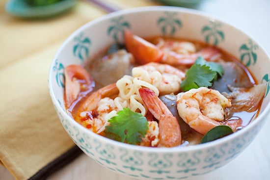 Quick and easy Thai red tom yum soup with noodles and prawns, ready to serve.