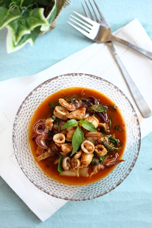 Easy homemade Thai basil squid is a made with squid, basil leaves, and roasted chili paste.