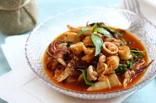 Easy and tasty chili sweet Thai basil with squid, in a bowl.