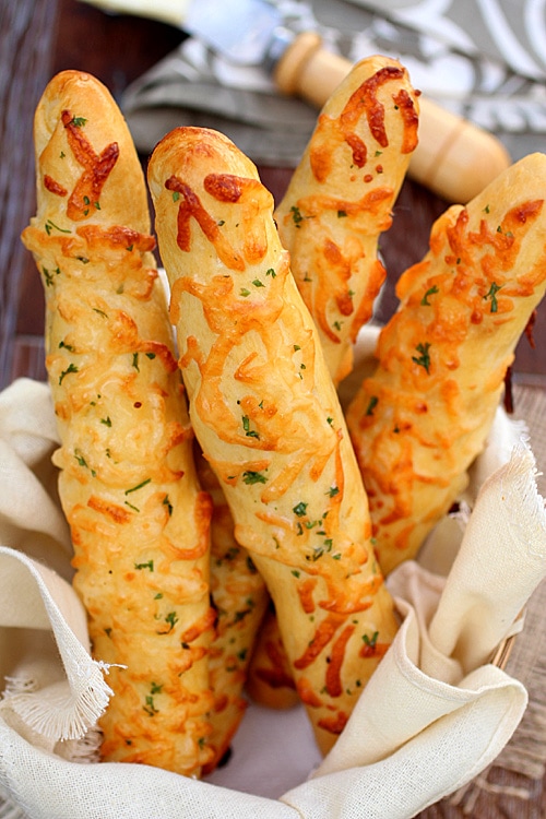 Easy homemade cheese breadsticks served in a bread basket.