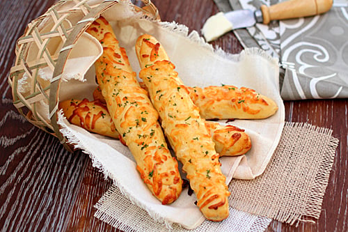 Easy homemade breadsticks with cheese served in a small bread basket.
