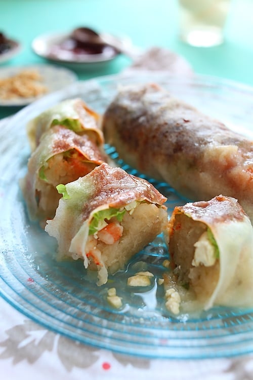 Easy homemade popiah (Malaysian Fresh Spring Rolls) sliced and served in a plate.