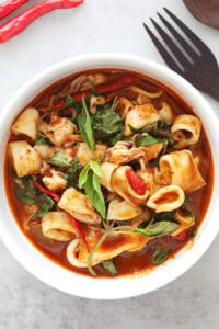 Thai squid recipe with spicy sauce, Thai basil and chilies.