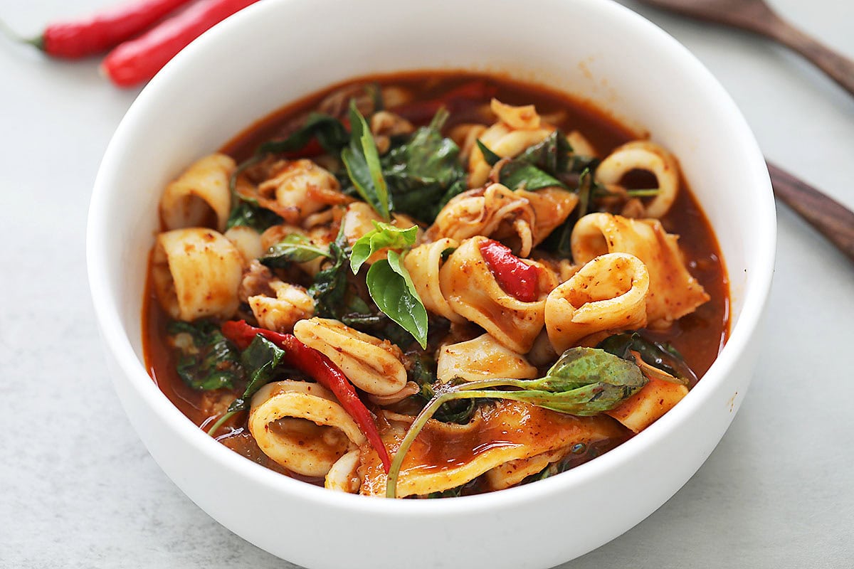 Thai squid recipe - Thai basil squid is ready to serve in a bowl. 