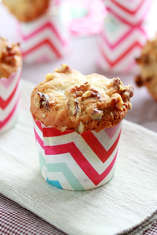 Easy and healthy homemade banana cream cheese cupcakes topped with walnuts.