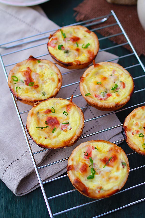 Easy and delicious homemade mini quiche appetizers on a cooling rack.