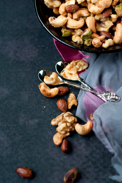 Easy homemade sweet and spicy holiday mixed nuts like almonds, walnuts, cashew nuts and pistachios.