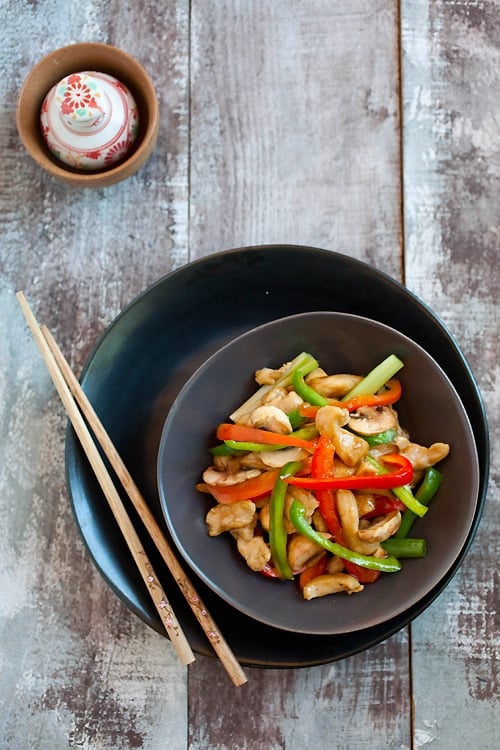 Top down view of easy and delicious Chinese stir fry chicken dish with bell peppers in brown sauce.