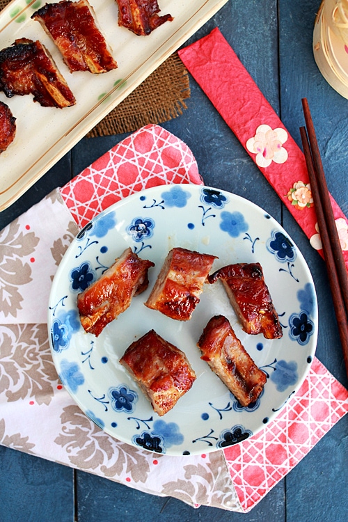 Top down view of honey glazed baby pork back ribs served in a plate.