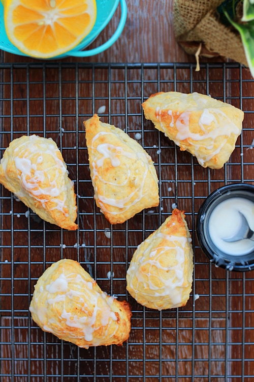 Easy and quick scones with lemon ginger glaze placed on cooling rack.
