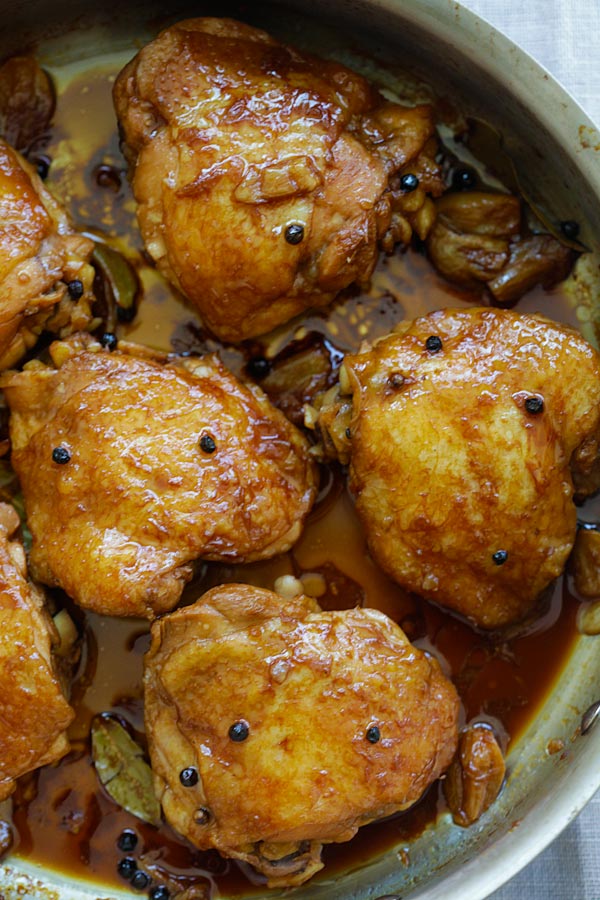 Authentic adobo chicken thighs with adobo sauce, ready to serve.