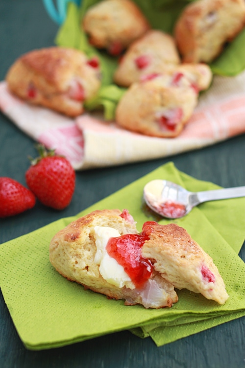 Easy and healthy homemade English strawberry scones spread with strawberry jam.