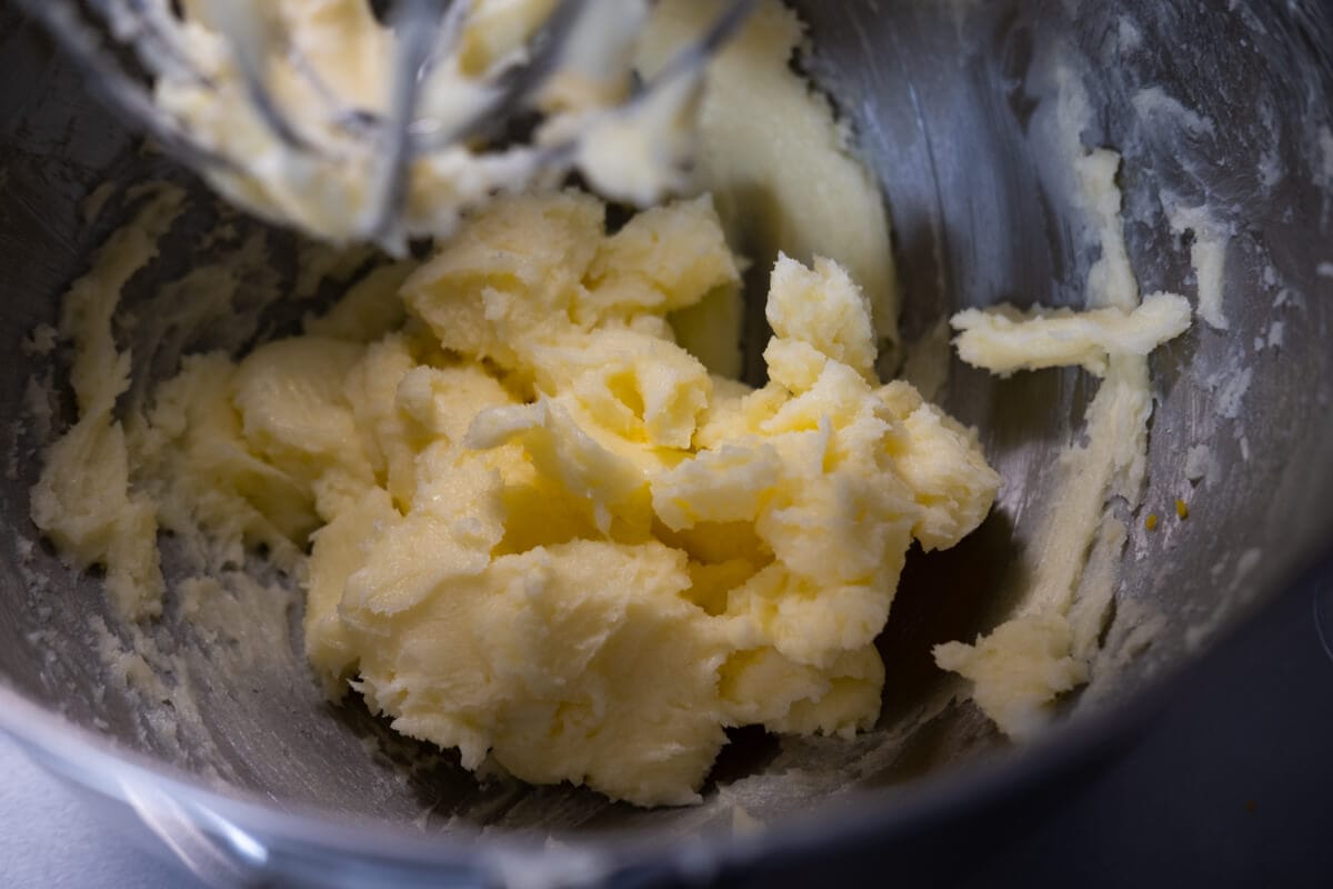Butter and sugar in a stand mixer. 
