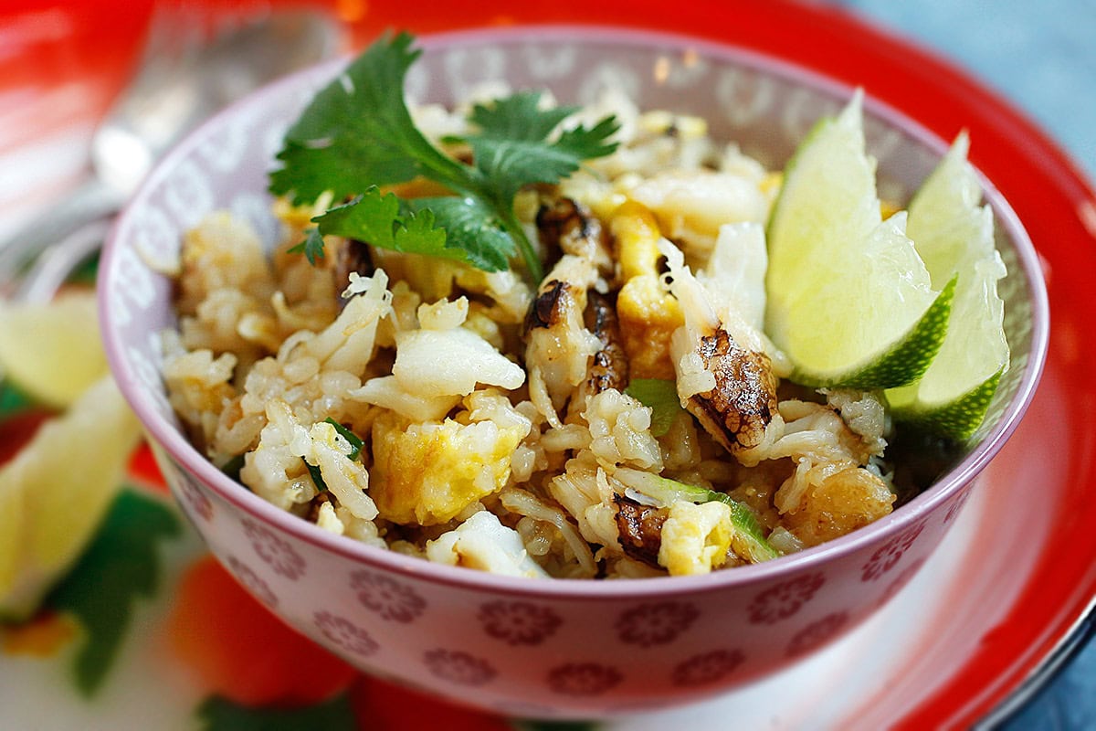 Fried rice loaded with crab meat on a serving platter. 