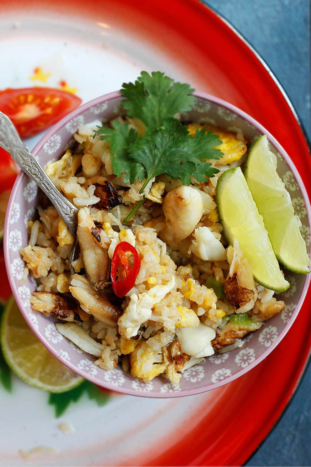 Crab fried rice, Thai style served with  chilies and lime wedges. 