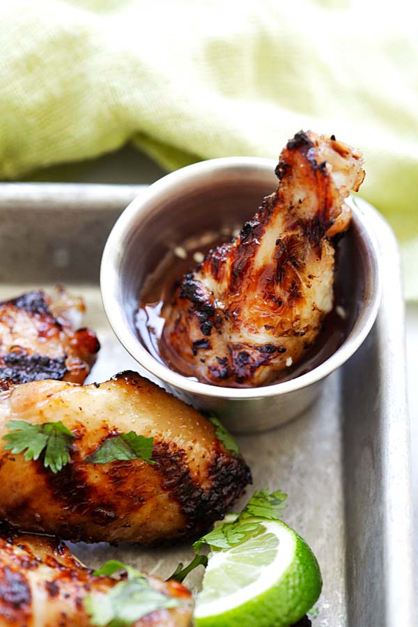 BBQ chicken wings with lemongrass and Asian seasonings dipped in chicken wing sauce.