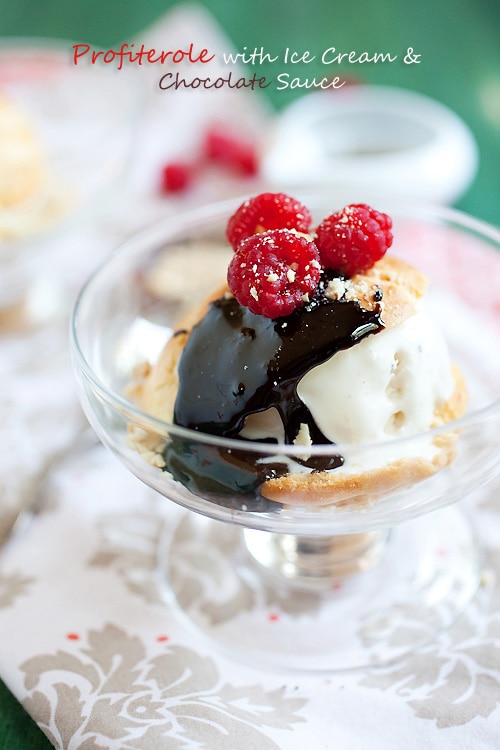 Easy and delicious French profiterole with ice cream topped with chocolate sauce, berries and ground peanuts.