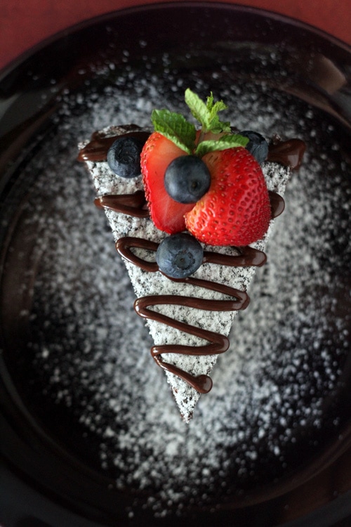 Top down view of a piece of easy no bake chocolate cake, served in a plate.