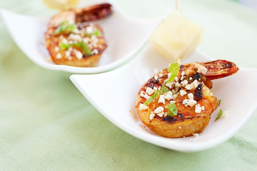 Pan fried sauteed shrimp skewers with pineapples and tamarind, ready to serve.