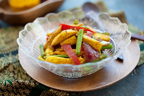 Easy authentic Malay turmeric chicken stir fry with skillet, ready to serve.