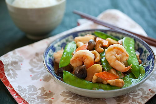 Quick and easy authentic Asian stir fry made with shrimps, cashew nuts, peas, mushrooms, carrots and ginger.