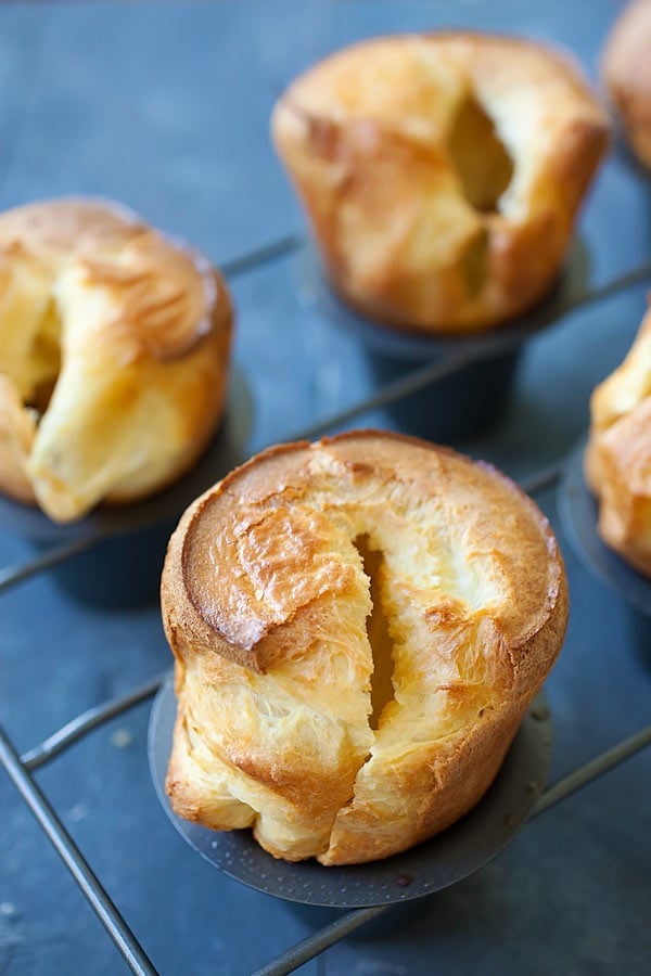 Close up of easy homemade mini popovers pastries, on a rack.