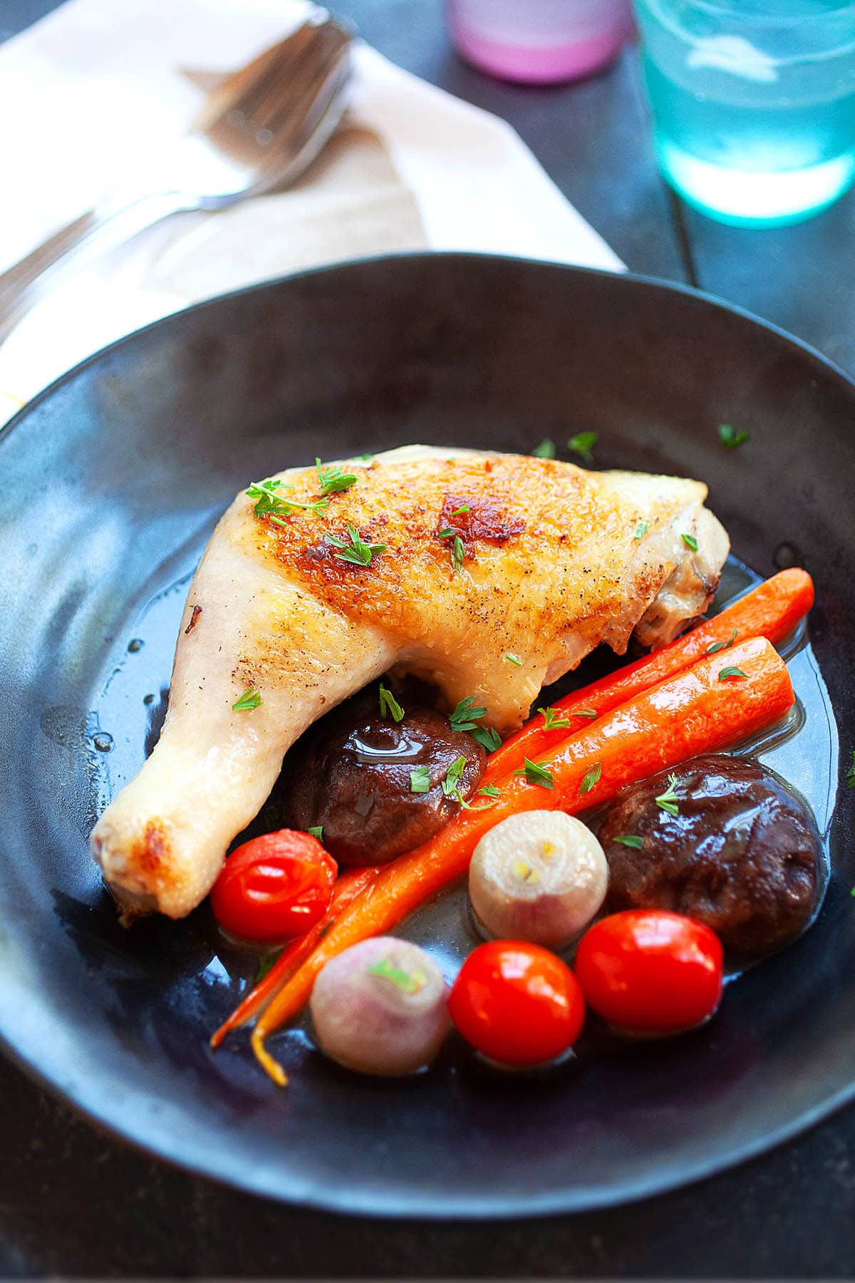 Braised chicken served on a plate.